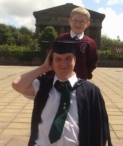 Richard standing behind his dad